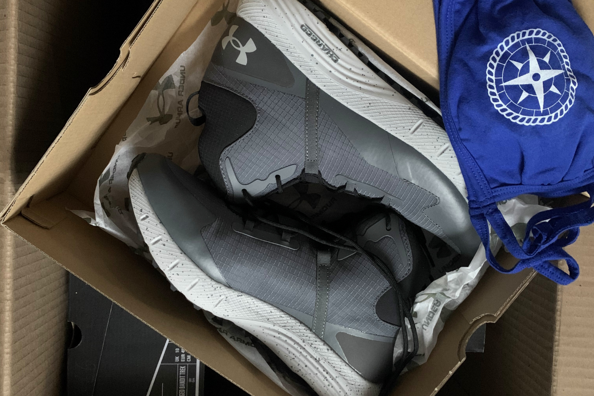 UA Boots Under Armour boots and a face mask packaged up